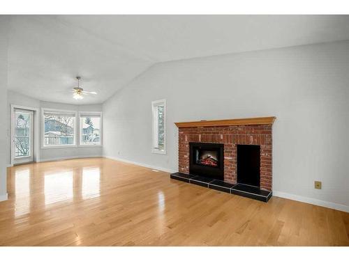 14 West Chapman Place, Cochrane, AB - Indoor Photo Showing Living Room With Fireplace