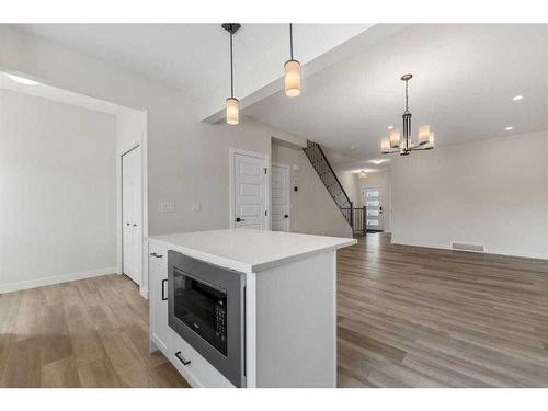 830 Bayview Terrace Sw, Airdrie, AB - Indoor With Fireplace