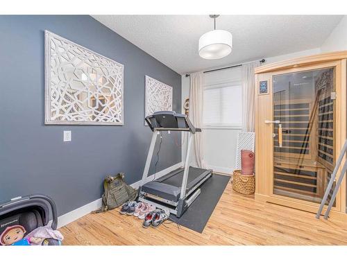 86 Schubert Hill Nw, Calgary, AB - Indoor Photo Showing Gym Room