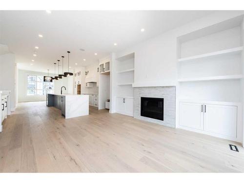 240 22 Avenue, Calgary, AB - Indoor Photo Showing Living Room With Fireplace