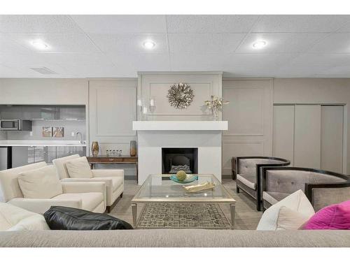 2C-133 25 Avenue Sw, Calgary, AB - Indoor Photo Showing Living Room With Fireplace