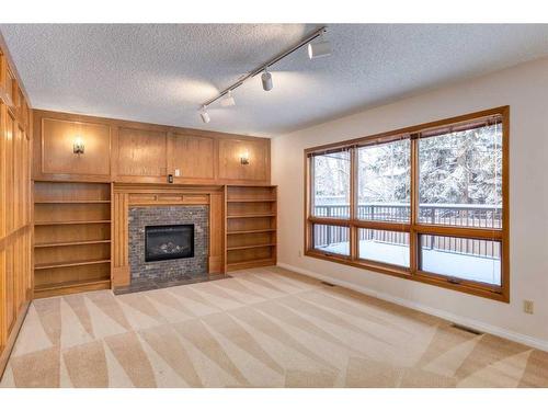 56 Edendale Way Nw, Calgary, AB - Indoor With Fireplace