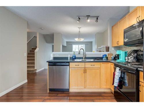 303 Toscana Gardens Nw, Calgary, AB - Indoor Photo Showing Kitchen With Double Sink