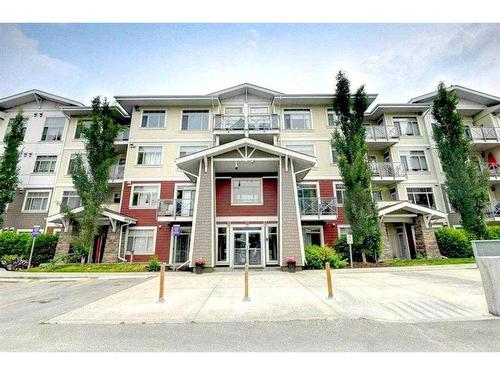 205-22 Auburn Bay Link Se, Calgary, AB - Outdoor With Balcony With Facade