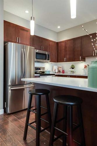 205-22 Auburn Bay Link Se, Calgary, AB - Indoor Photo Showing Kitchen With Stainless Steel Kitchen With Upgraded Kitchen