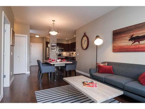 205-22 Auburn Bay Link Se, Calgary, AB - Indoor Photo Showing Living Room