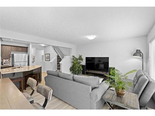 345 Hillcrest Square Sw, Airdrie, AB - Indoor Photo Showing Living Room