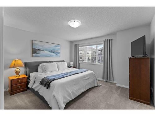 345 Hillcrest Square Sw, Airdrie, AB - Indoor Photo Showing Bedroom