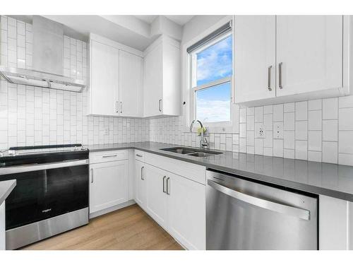 105-65 Belvedere Point Se, Calgary, AB - Indoor Photo Showing Kitchen With Double Sink With Upgraded Kitchen