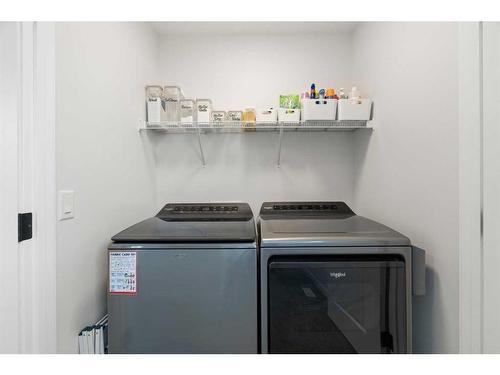 14 Wolf Creek Manor Se, Calgary, AB - Indoor Photo Showing Laundry Room