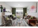 14 Wolf Creek Manor Se, Calgary, AB  - Indoor Photo Showing Living Room 