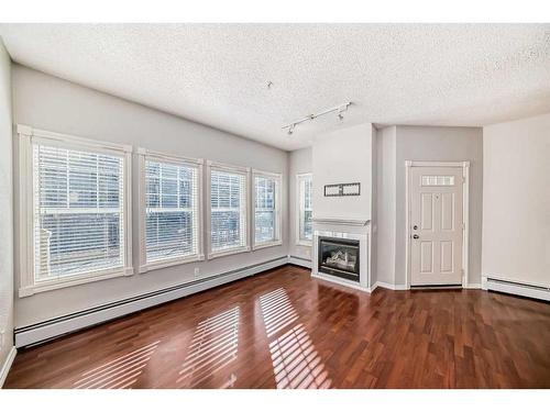 105-112 14 Avenue Se, Calgary, AB - Indoor Photo Showing Other Room With Fireplace