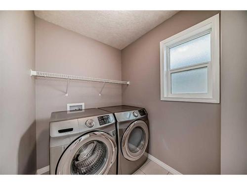 21 Sherwood Street Nw, Calgary, AB - Indoor Photo Showing Laundry Room