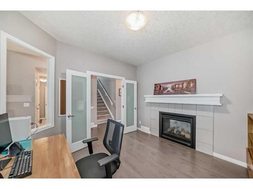 21 Sherwood Street Nw, Calgary, AB - Indoor With Fireplace