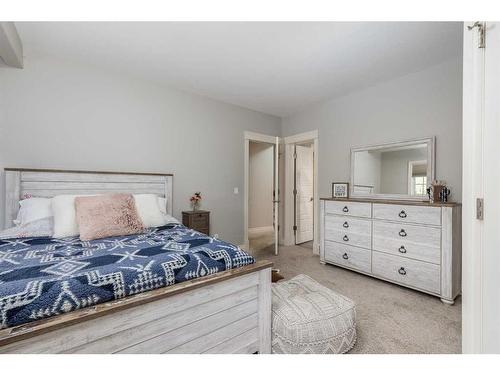 1093 Coopers Drive Sw, Airdrie, AB - Indoor Photo Showing Bedroom