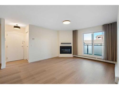 1712 Edenwold Heights Nw, Calgary, AB - Indoor Photo Showing Living Room With Fireplace