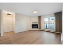 1712 Edenwold Heights Nw, Calgary, AB  - Indoor Photo Showing Living Room With Fireplace 