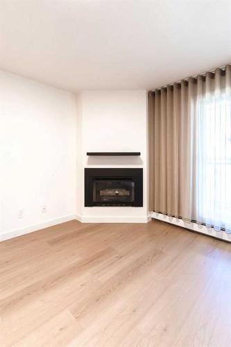 1712 Edenwold Heights Nw, Calgary, AB - Indoor Photo Showing Living Room With Fireplace