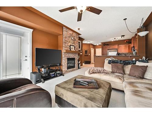 540-10 Discovery Ridge Close Sw, Calgary, AB - Indoor Photo Showing Living Room With Fireplace