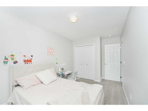 174 Carringsby Way Nw, Calgary, AB - Indoor Photo Showing Bedroom