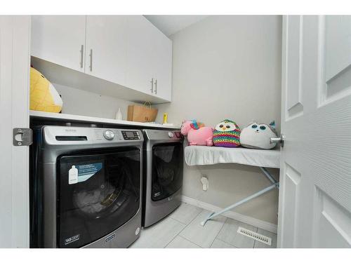 174 Carringsby Way Nw, Calgary, AB - Indoor Photo Showing Laundry Room