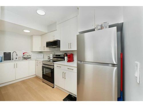 174 Carringsby Way Nw, Calgary, AB - Indoor Photo Showing Kitchen With Stainless Steel Kitchen