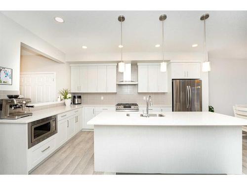 174 Carringsby Way Nw, Calgary, AB - Indoor Photo Showing Kitchen With Stainless Steel Kitchen With Double Sink With Upgraded Kitchen