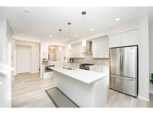 174 Carringsby Way Nw, Calgary, AB - Indoor Photo Showing Kitchen With Stainless Steel Kitchen With Upgraded Kitchen