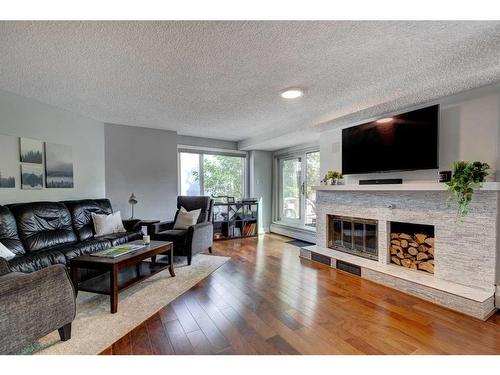 302-1731 9A Street Sw, Calgary, AB - Indoor Photo Showing Living Room With Fireplace