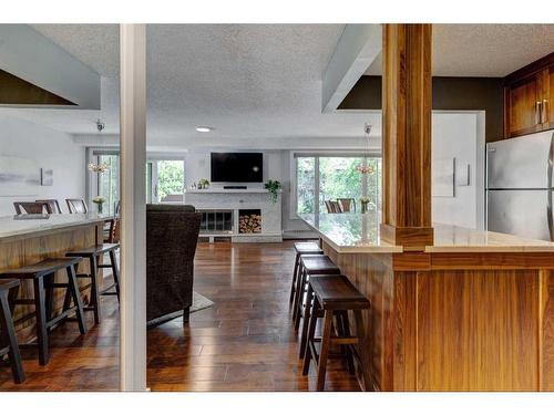 302-1731 9A Street Sw, Calgary, AB - Indoor Photo Showing Kitchen With Fireplace