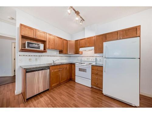 115-333 Riverfront Avenue Se, Calgary, AB - Indoor Photo Showing Kitchen With Double Sink