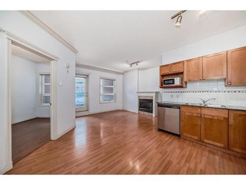 115-333 Riverfront Avenue Se, Calgary, AB - Indoor Photo Showing Kitchen With Double Sink