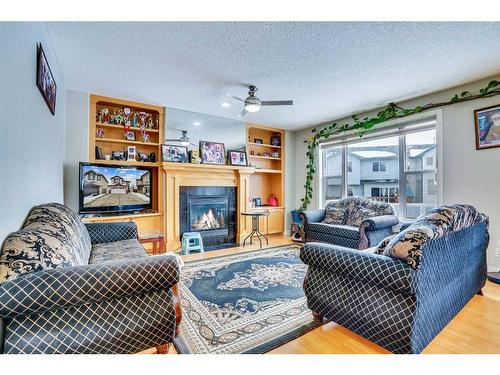 63 New Brighton Close Se, Calgary, AB - Indoor Photo Showing Living Room With Fireplace