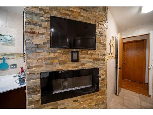 244 High Point Estates, Rural Rocky View County, AB - Indoor Photo Showing Living Room With Fireplace