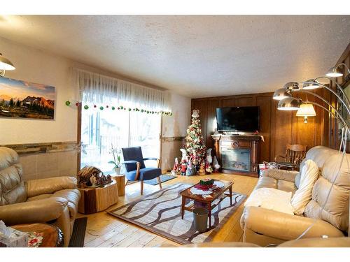 244 High Point Estates, Rural Rocky View County, AB - Indoor Photo Showing Living Room With Fireplace