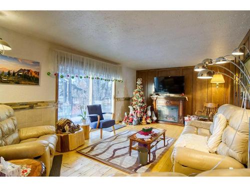 244 High Point Estates, Rural Rocky View County, AB - Indoor Photo Showing Living Room With Fireplace