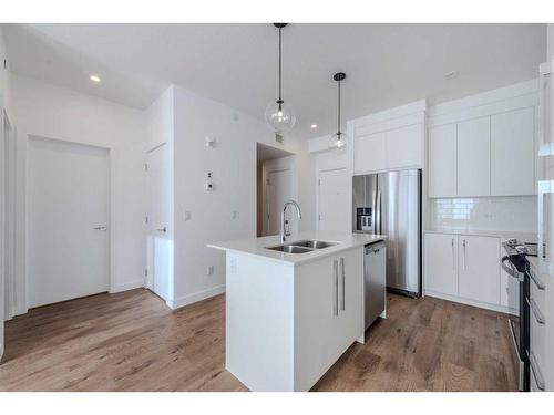 3407-111 Wolf Creek Drive Se, Calgary, AB - Indoor Photo Showing Kitchen With Double Sink With Upgraded Kitchen