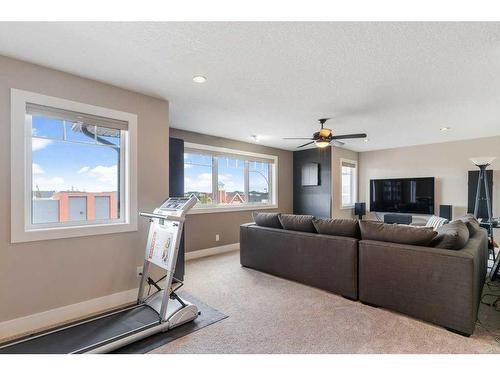 281 Kinniburgh Boulevard, Chestermere, AB - Indoor Photo Showing Other Room With Fireplace