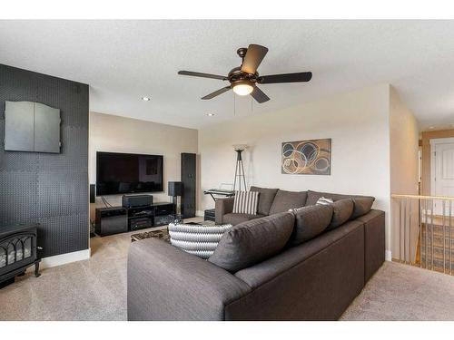 281 Kinniburgh Boulevard, Chestermere, AB - Indoor Photo Showing Living Room