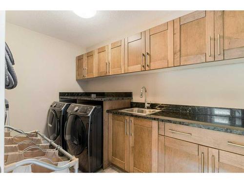 281 Kinniburgh Boulevard, Chestermere, AB - Indoor Photo Showing Laundry Room