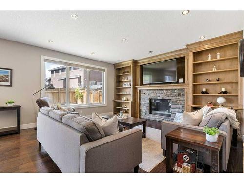 281 Kinniburgh Boulevard, Chestermere, AB - Indoor Photo Showing Living Room With Fireplace