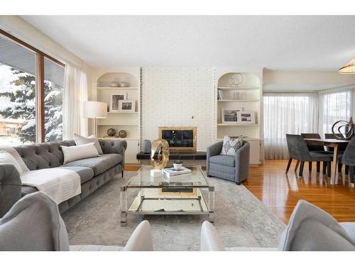 4719 Vanguard Place Nw, Calgary, AB - Indoor Photo Showing Living Room With Fireplace