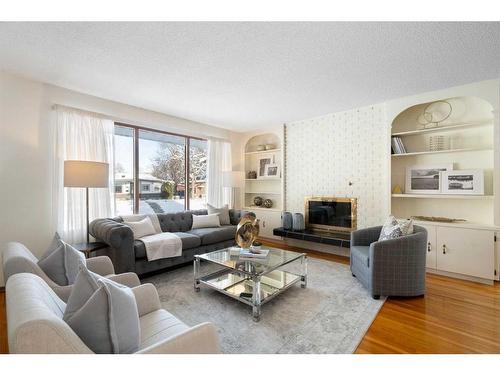 4719 Vanguard Place Nw, Calgary, AB - Indoor Photo Showing Living Room With Fireplace