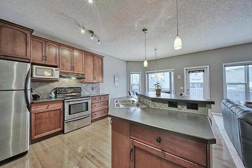 200 Saddlecrest Way Ne, Calgary, AB - Indoor Photo Showing Kitchen With Double Sink