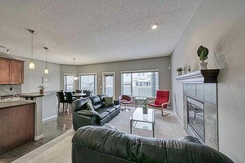 200 Saddlecrest Way Ne, Calgary, AB - Indoor Photo Showing Living Room With Fireplace