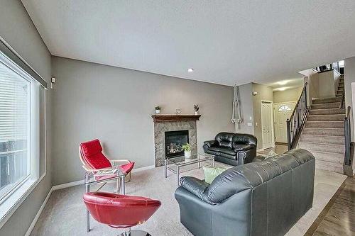 200 Saddlecrest Way Ne, Calgary, AB - Indoor Photo Showing Living Room With Fireplace