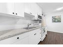 442-406 Blackthorn Road Ne, Calgary, AB  - Indoor Photo Showing Kitchen With Double Sink 