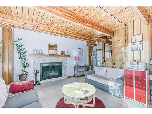 902 11Th Street, Canmore, AB - Indoor Photo Showing Living Room With Fireplace