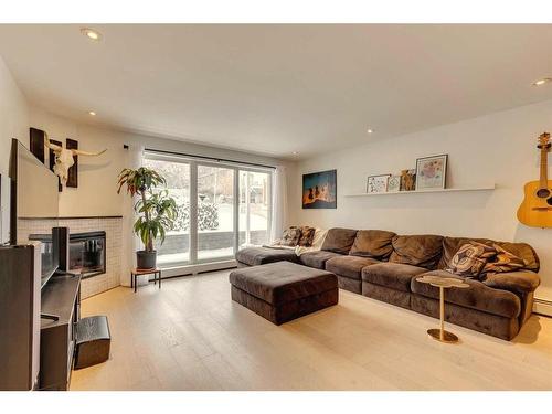 3-1611 26 Avenue Sw, Calgary, AB - Indoor Photo Showing Living Room With Fireplace