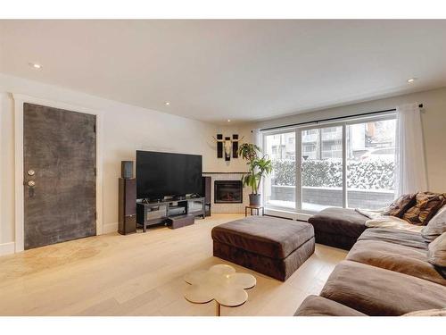 3-1611 26 Avenue Sw, Calgary, AB - Indoor Photo Showing Living Room With Fireplace